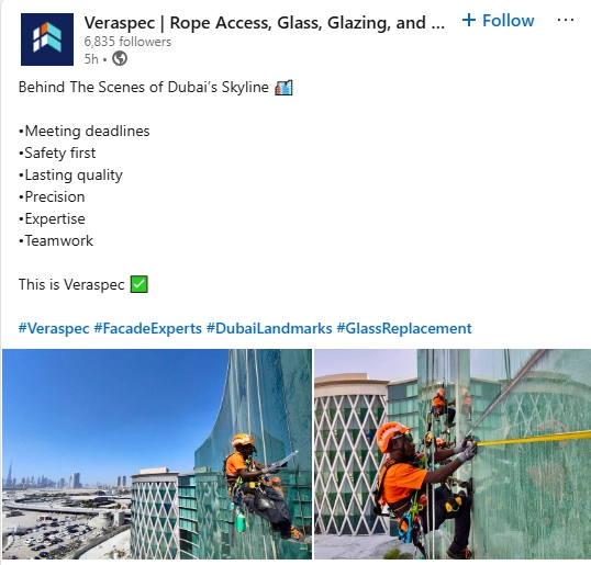 Facade experts at work on Dubai's skyline Facade maintenance workers in safety gear performing high-rise glass replacement on a Dubai skyscraper using rope access techniques.