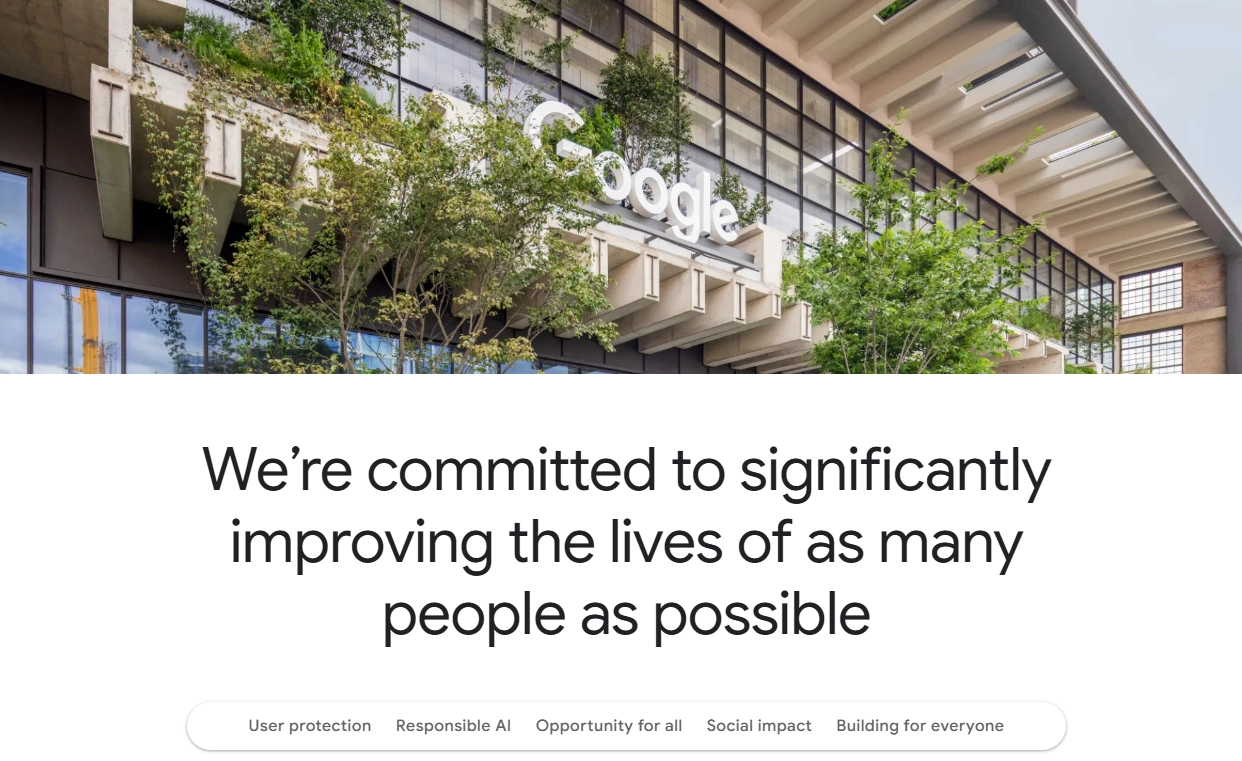 Google's Commitment to Social Impact, AI Ethics & Inclusion Exterior of Google HQ with a message on responsible AI, user protection, and improving lives through tech and innovation for everyone.